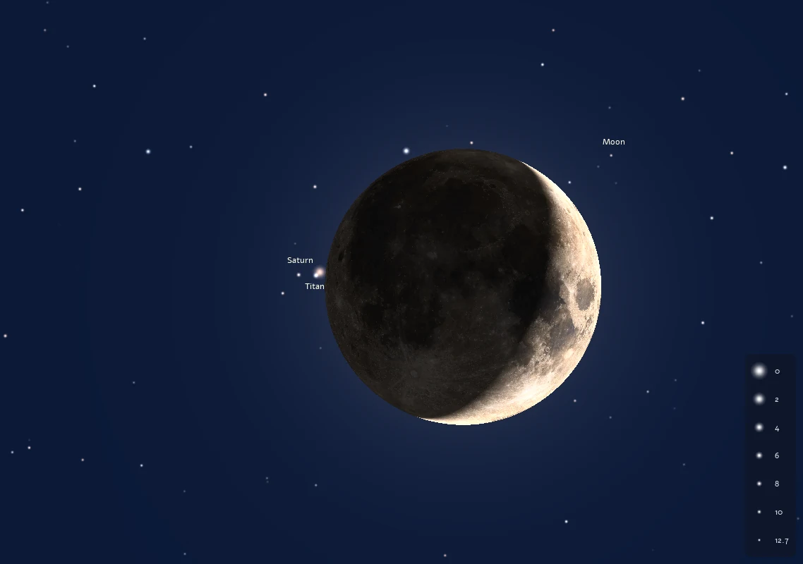 A crescent Moon with its night side lit by earthshine, and Saturn with its moon Titan just off the dark edge